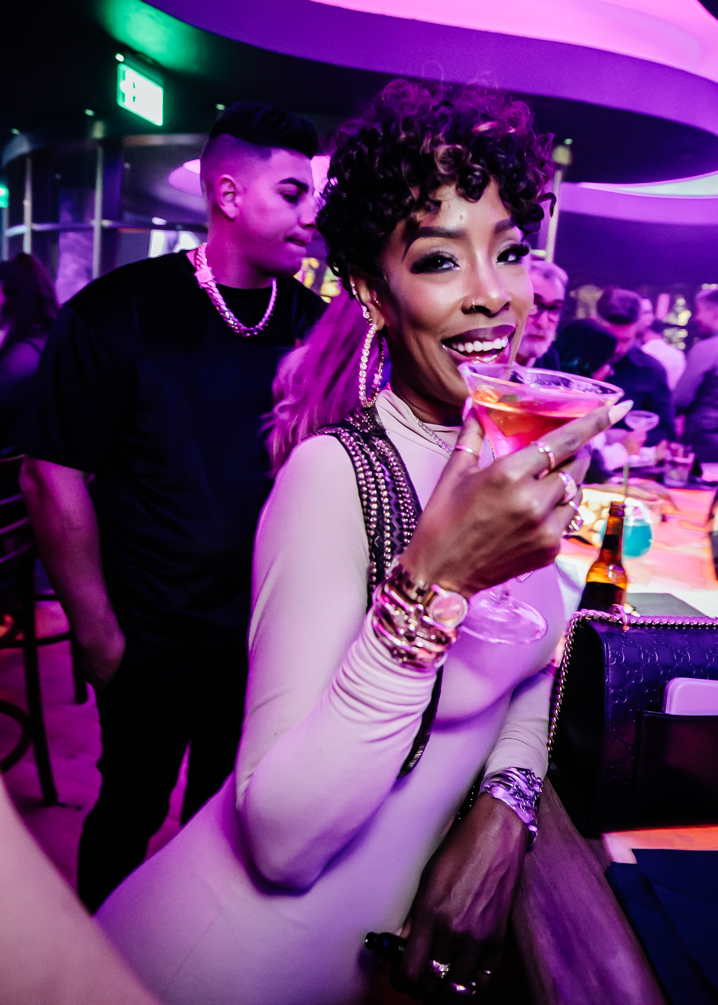 Guest sipping a specialty cocktail at Blue Martini's bar in Brickell